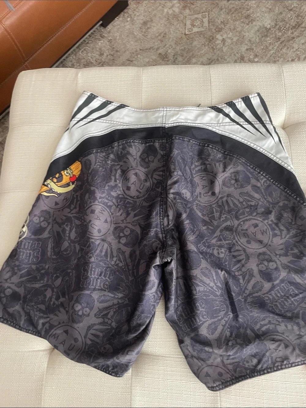 Maui and Sons Black Swim Shorts with Red & Yellow Skull Graphic